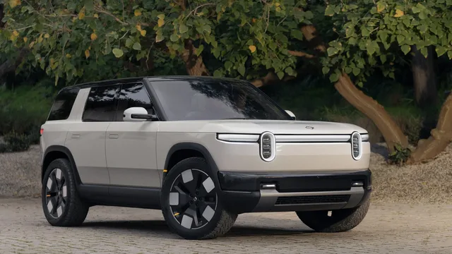 2026 Rivian R2 Front Three-Quarter View Under Trees