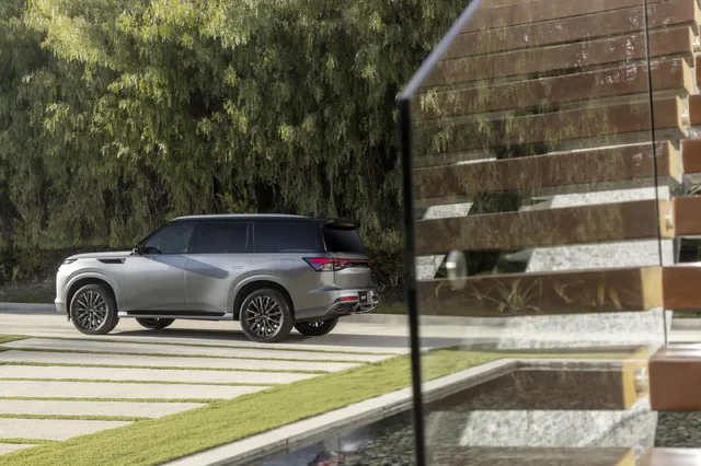 2025 Infiniti QX80 passenger rear quarter at luxury estate