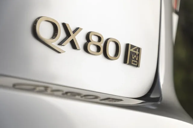 2025 Infiniti QX80 rear badge and 4WD emblem close-up