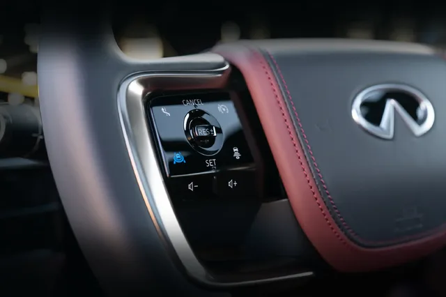 2025 Infiniti QX80 steering wheel controls close-up