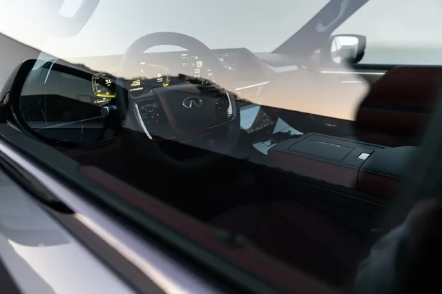 2025 Infiniti QX80 dashboard seen through window