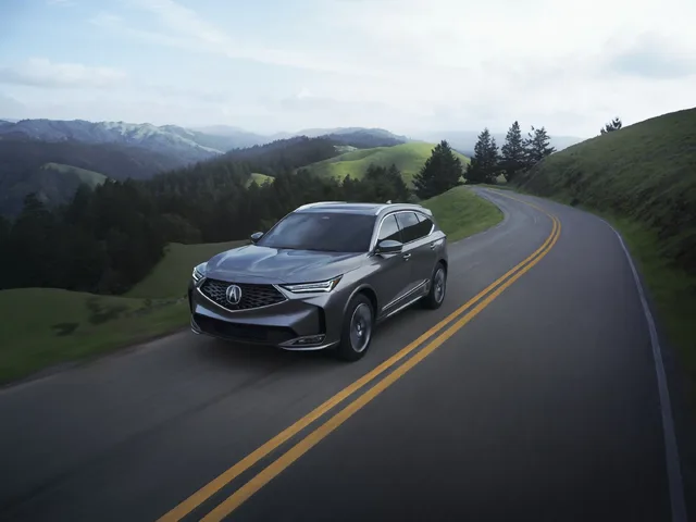 2025 Acura MDX Advance Package Front Three-Quarter View on a Mountain Road