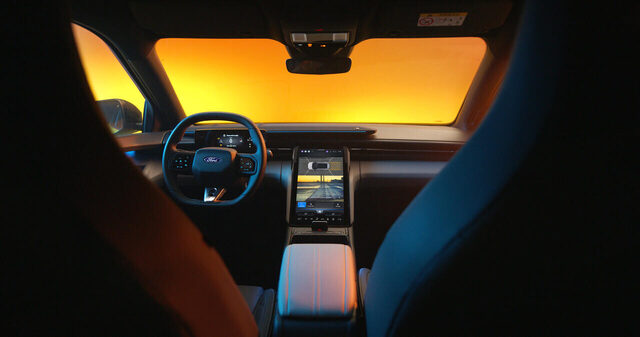 2024 Ford Capri interior dashboard with portrait touchscreen at night