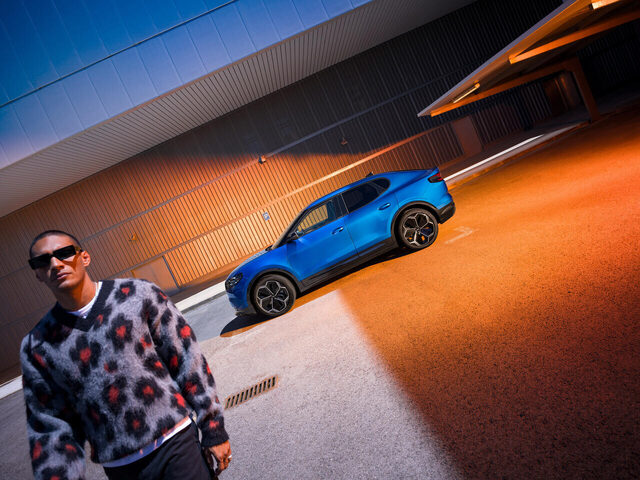 2024 Ford Capri side profile in Blue with lifestyle model