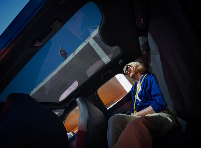 2024 Ford Capri rear seat passenger enjoying panoramic glass roof