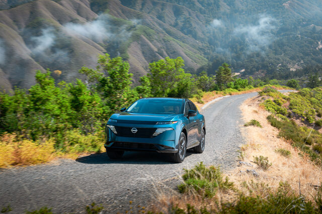 2025 Nissan Murano front three-quarter driving on winding mountain road