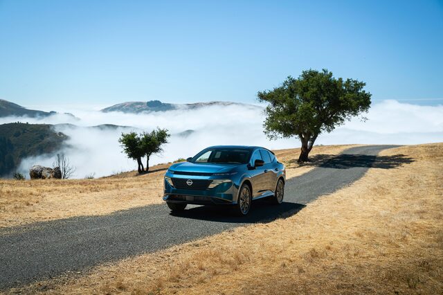 2025 Nissan Murano front three-quarter view on hilltop above fog