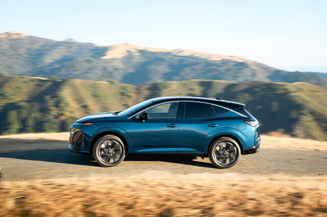 2025 Nissan Murano driver side profile in motion on mountain road
