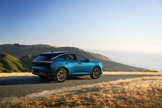 2025 Nissan Murano rear three-quarter view with coastal mountains