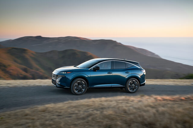 2025 Nissan Murano driver side profile driving on coastal mountain road