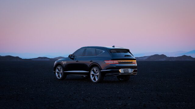 Genesis Blank Canvas Campaign GV80 Coupe Rear Three-Quarter View at Dusk