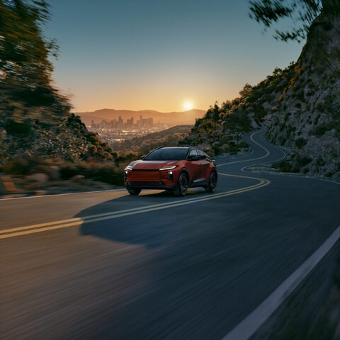 2026 Toyota C-HR Front Three-Quarter View Driving on Mountain Road at Sunset