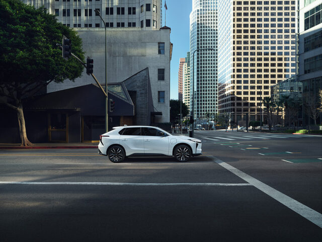 2026 Toyota bZ Side Profile in White on Downtown Street