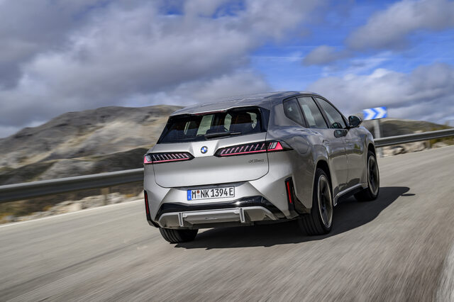 2026 BMW iX3 Rear Three-Quarter View on Mountain Road