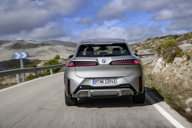 2026 BMW iX3 Rear View Driving on Mountain Road