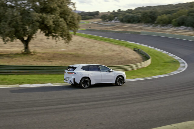 2026 BMW iX3 Rear Three-Quarter Action Shot on Track