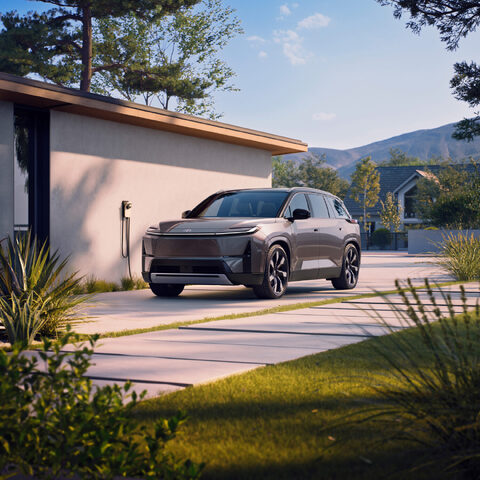 2027 Toyota Highlander EV Plugged In at Home Charger