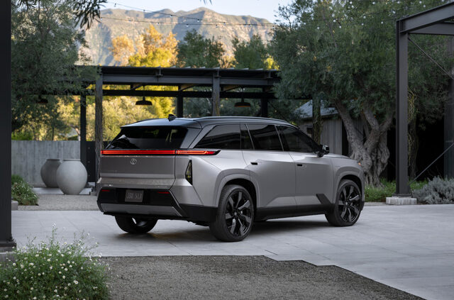 2027 Toyota Highlander EV Rear Three-Quarter View with Mountains