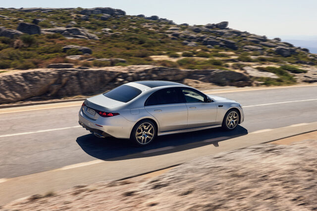 2027 Mercedes-Benz S-Class in Silver Rear Three-Quarter Driving on Mountain Road