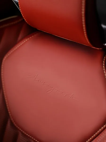 2027 Infiniti QX65 Autograph Interior Seat Closeup with Embossed Autograph Script in Red Leather