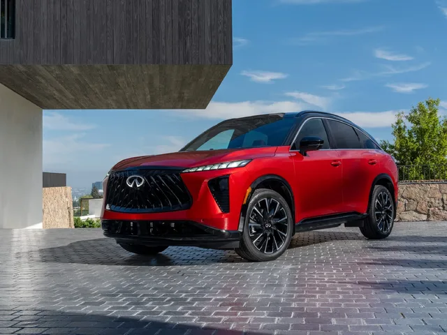 2027 Infiniti QX65 Sport Exterior Front Three-Quarter View Sunfire Red with Black Roof and Grille