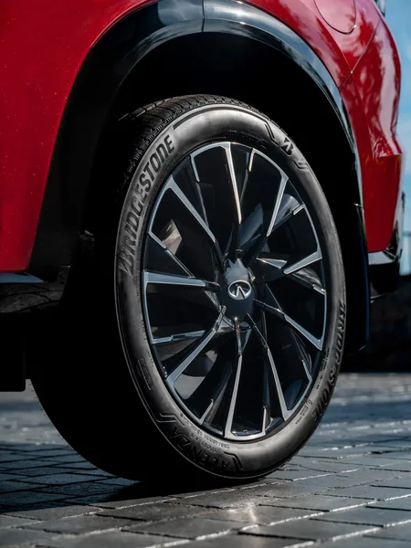 2027 Infiniti QX65 Sport Exterior Wheel Closeup Dark Multi-Spoke Alloy with Bridgestone Tire