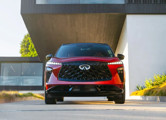 2027 Infiniti QX65 Sport Exterior Direct Front View Showing Diamond-Pattern Grille and LED Headlights Sunfire Red