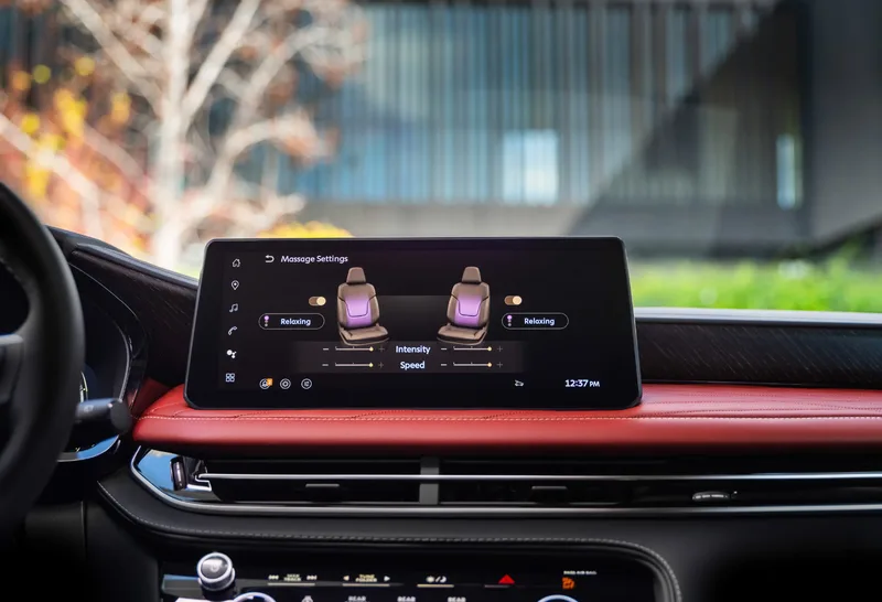 2027 Infiniti QX65 Interior 12.3-Inch Infotainment Screen Showing Massage Settings Red Leather Dash