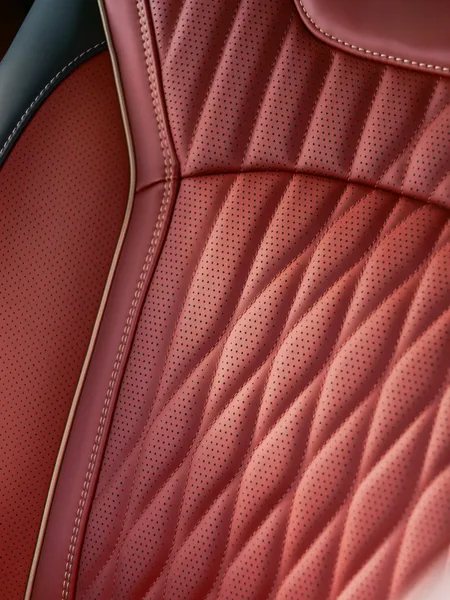 2027 Infiniti QX65 Interior Perforated Red Leather Seat Closeup with Diamond Quilting Pattern