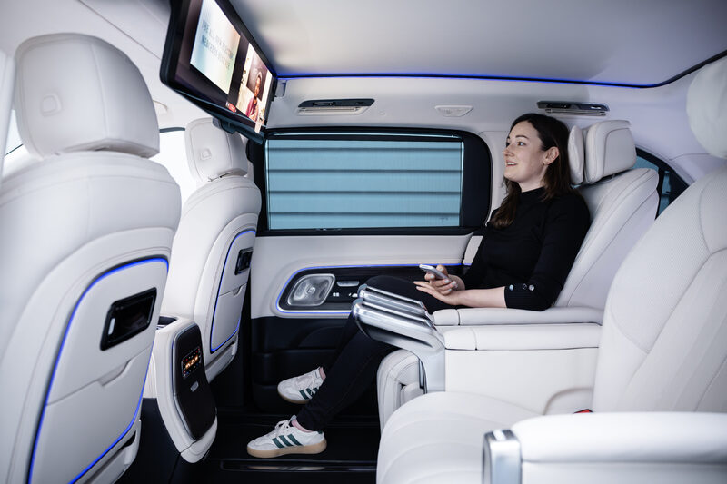 2027 Mercedes-Benz VLE MPV rear passenger playing video games on ceiling screen with controller