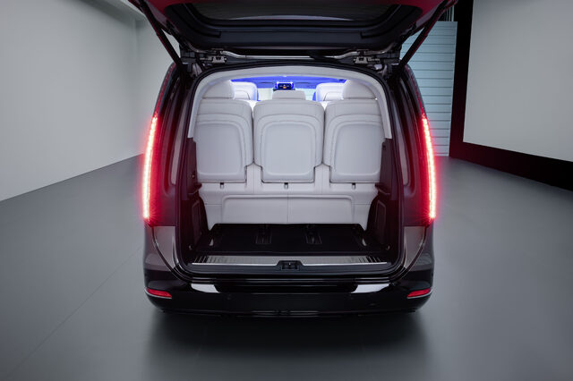 2027 Mercedes-Benz VLE MPV second-row captain's chairs through open sliding door with ambient lighting