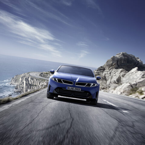 2027 BMW i3 Sedan Front View on Coastal Road