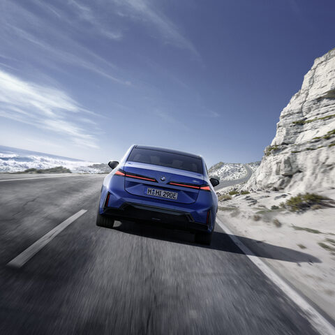 2027 BMW i3 Sedan Rear View Low Angle on Highway