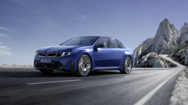 2027 BMW i3 Sedan Front Three-Quarter with Mountain Backdrop