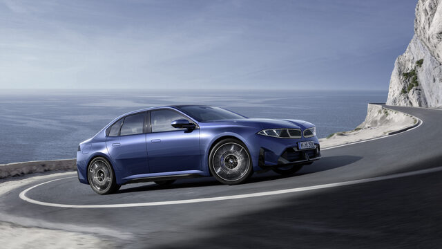 2027 BMW i3 Sedan Front Three-Quarter Action Shot on Mountain Road