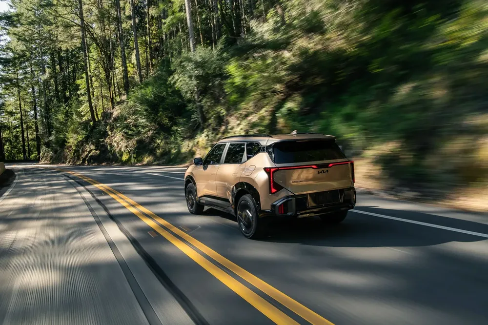 2027 Kia Seltos rear three quarter view running shot